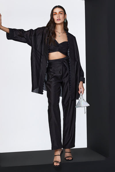 RM-Black cape and bustier paired with pants and tie up belt 